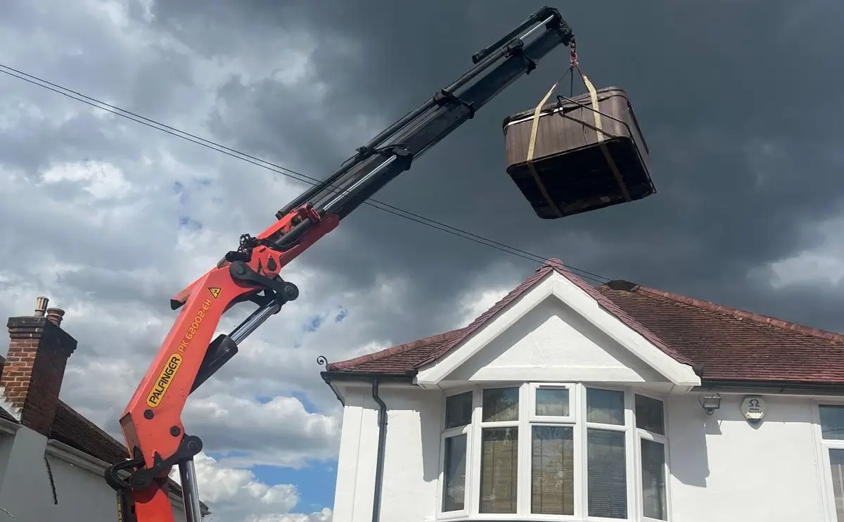 Shoma Crane Hire HIAB lifting a heavy load at a residential property